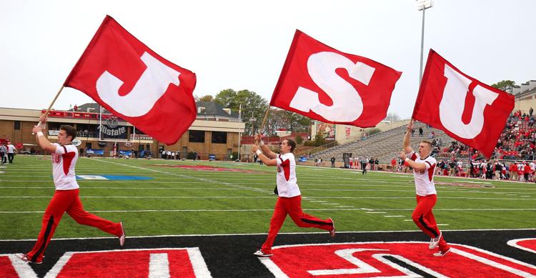 jsu boomtown jsu cheerleaders with flags on football field